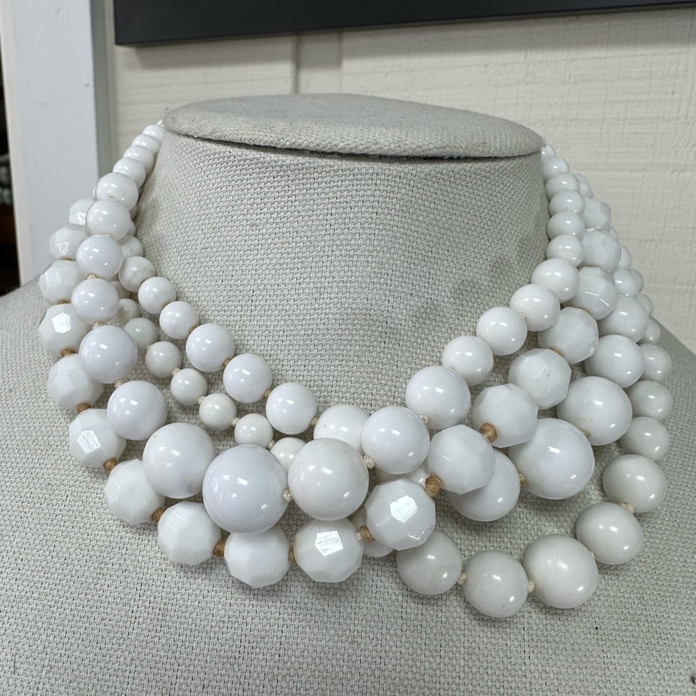 Four vintage gumball style white necklaces